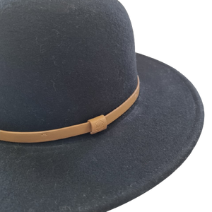 A black hat with a wide sewn brim, a elegant thin tan band and made from 100% Australian wool