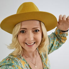 Load image into Gallery viewer, women wearing mustard unisex oval shaped Australian wool hat that suits any occasion, classic style and look.