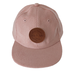 peach colour children and adult cotton corduroy cap featuring a leather Nix & Ash logo patch 