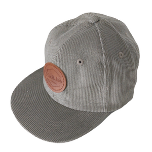 green colour children and adult cotton corduroy cap featuring a leather Nix & Ash logo patch 